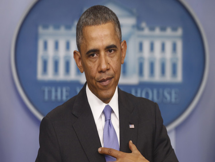 President Barack Obama speaks about his signature health care law, Thursday, Nov. 14, 2013, in the Brady Press Briefing Room of the White House in Washington. Bowing to pressure, President Barack Obama intends to permit continued sale of individual insurance plans that have been canceled because they failed to meet coverage standards under the health care law, officials said Thursday. (AP Photo/Charles Dharapak)