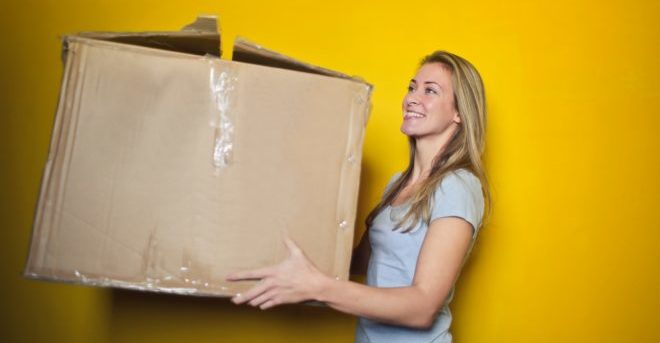 woman-in-grey-shirt-holding-brown-cardboard-box-761999