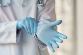 person-wearing-blue-sterile-gloves-3985168