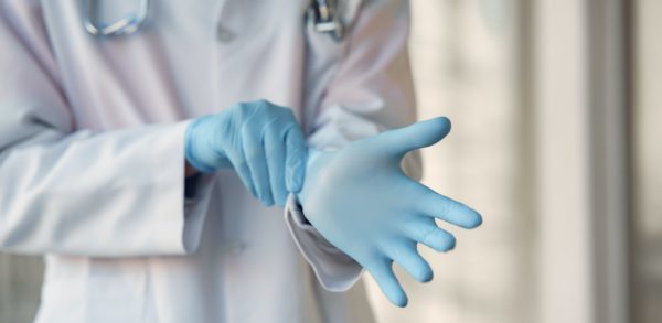 person-wearing-blue-sterile-gloves-3985168