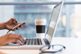 person-using-macbook-air-on-table-1181248