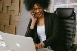 woman-in-black-blazer-sitting-on-black-office-chair-3727464