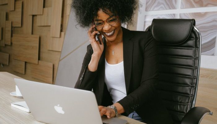 woman-in-black-blazer-sitting-on-black-office-chair-3727464